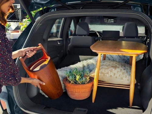 2024 Ford Escape view of woman loading stuff into cargo area